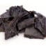 Photograph of a small amount of black dried beef liver dog treats..