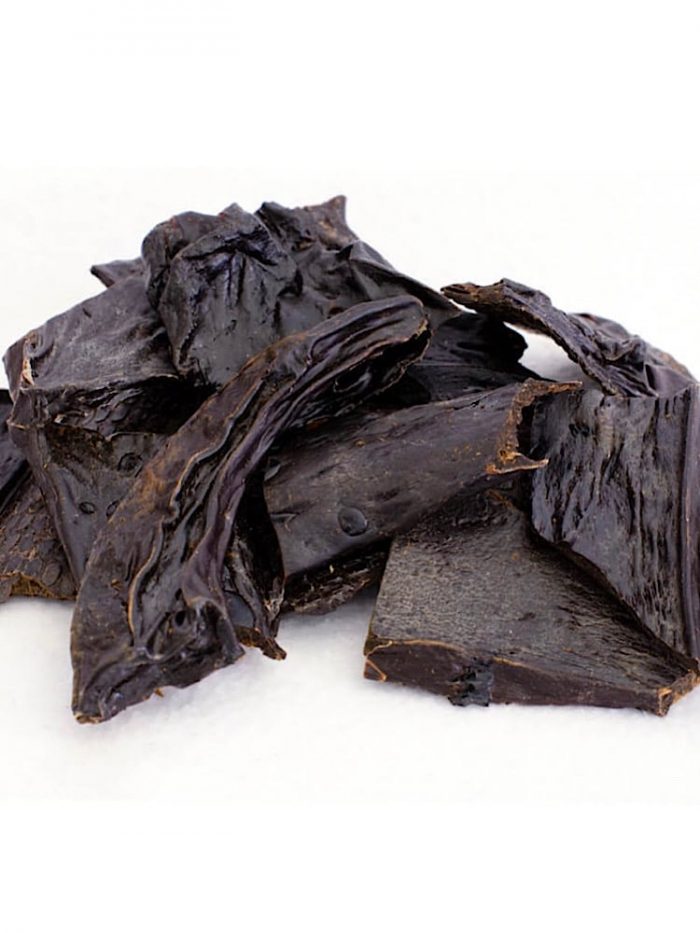 Photograph of a small amount of black dried beef liver dog treats..