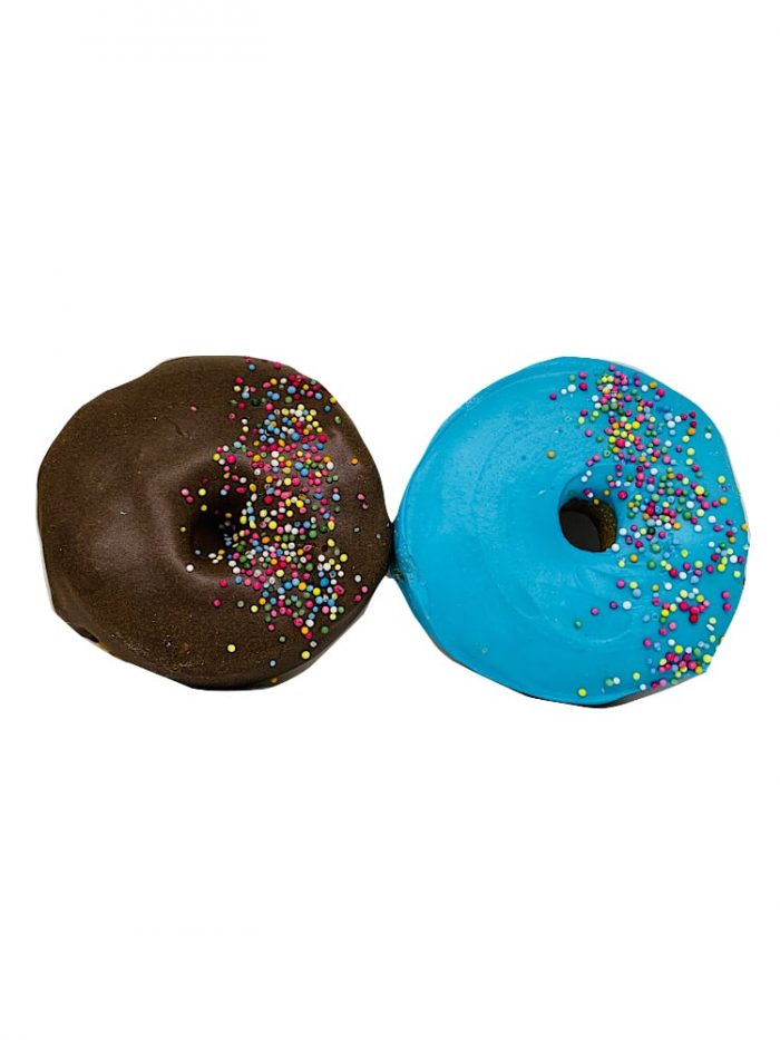Drool Pet Co. Photograph of two doggy donuts side by side one carob with sprinkles and another blue with sprinkles.on a white background.