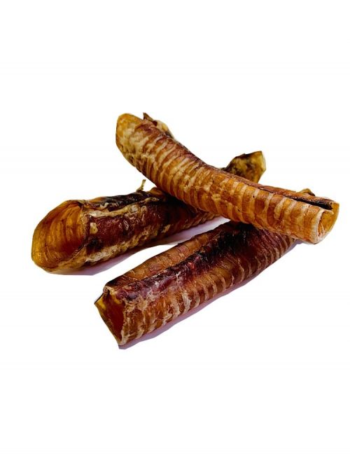 Photograph of three dehydrated beef moo tubes stacked on top another on a white background.
