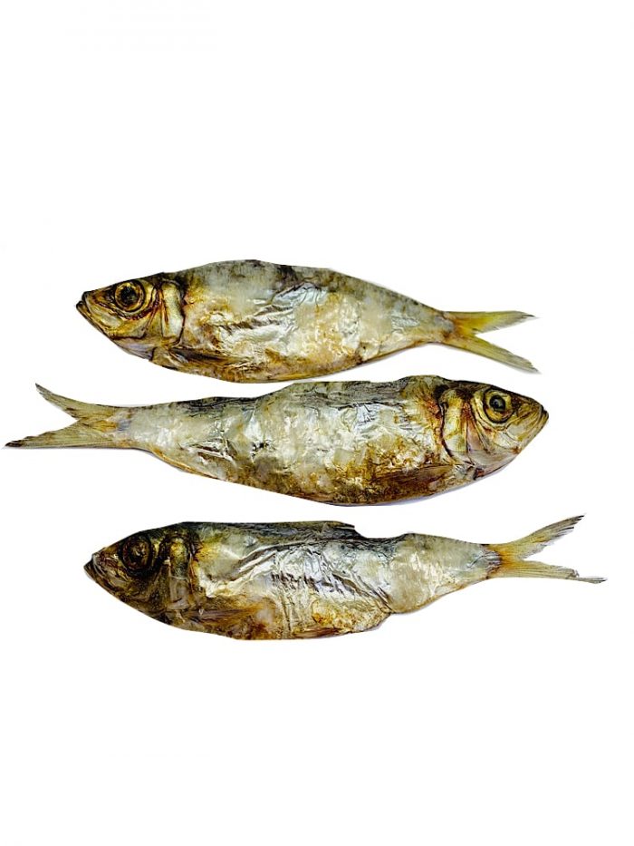Drool Pet Co. dried sardines for dogs and cat treats. Photograph of three dried whole sardines on a white background.